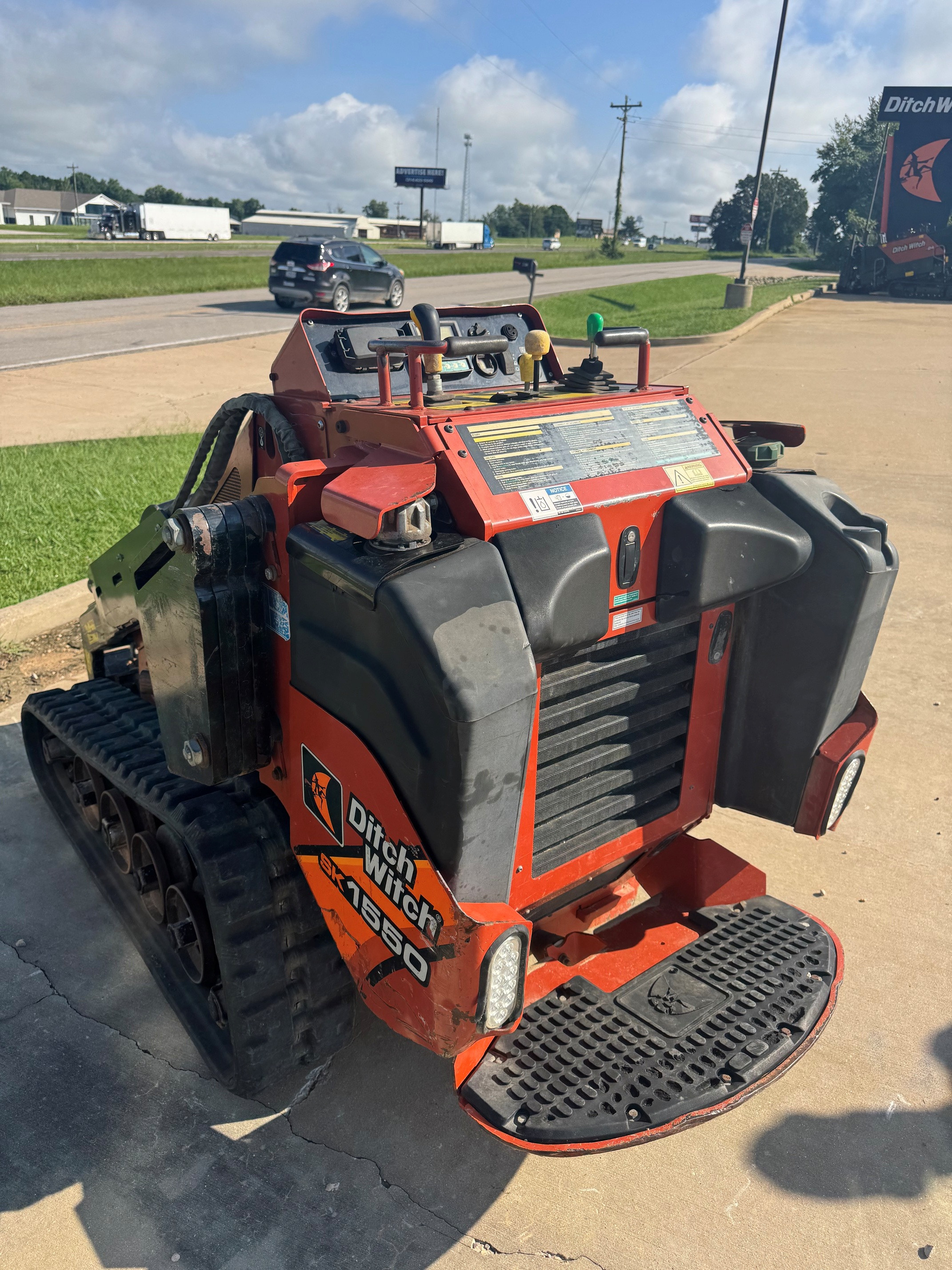 2018 Ditch Witch SK1550 with weight kit and brush guard.